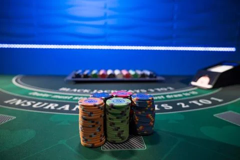 Gambling chips on a gaming table Stock Photos