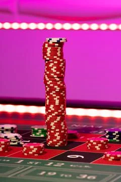 Gambling chips on a gaming table Stock Photos
