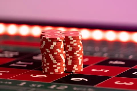 Gambling chips on a gaming table Stock Photos