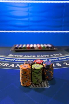 Gambling chips on a gaming table Stock Photos