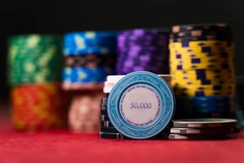 Gambling chips on a gaming table Stock Photos