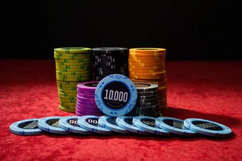 Gambling chips on a gaming table Stock Photos