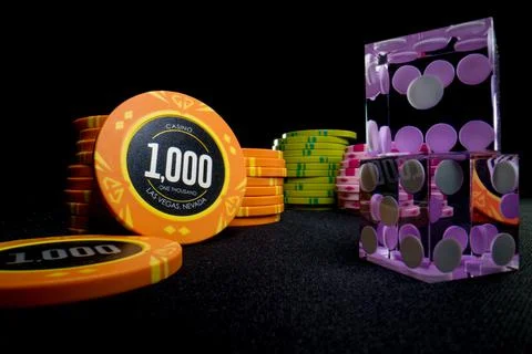 Gambling chips on a gaming table Stock Photos