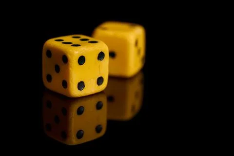 Gambling. Two dice on a black background with reflection Stock Photos