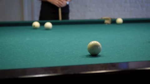 Game of billiards. Close-up of a player hitting a cue in a billiard ball. Stock Footage 119952770