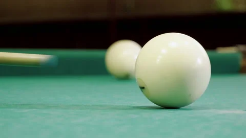 Game of billiards. Cue hitting ball with number 7 into pocket on billiard table Video stock 110295836