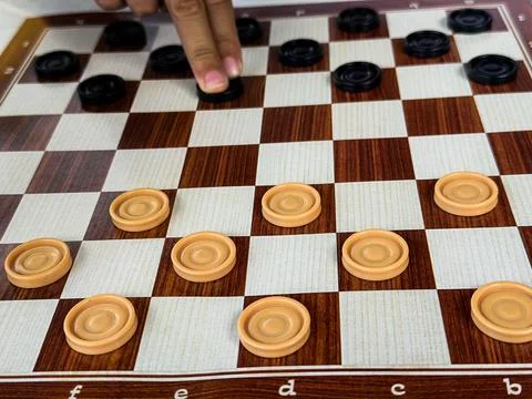The game of checkers between two players on a summer evening in Italy Stock Photos