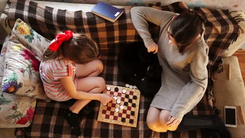 The game of checkers of two sisters Stock Footage 94055818