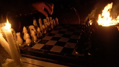 Game of chess against the backdrop of the fire, the start of game with pawn move 库存影片 114371385