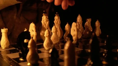Game of chess against the backdrop of the fire, the start of game with pawn move Stock Footage 114371388