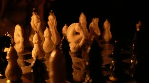 Game of chess against the backdrop of the fire, the start of game with pawn move 库存影片 114371409
