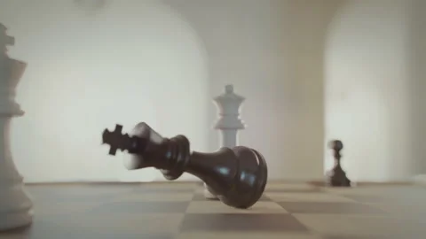 The game of chess. Checkmate, game over. King falls. Close-up macro shot of Stock Footage 225333628
