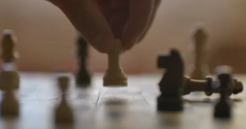 Game of Chess. Close Up of Hand Confident Businessman Playing Chess Game to D Stock Footage 142142572