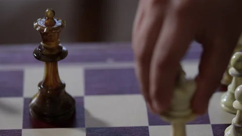 Game of chess. Man's hand moves a chess piece to victory. Strategy concept Stock Footage 132670683