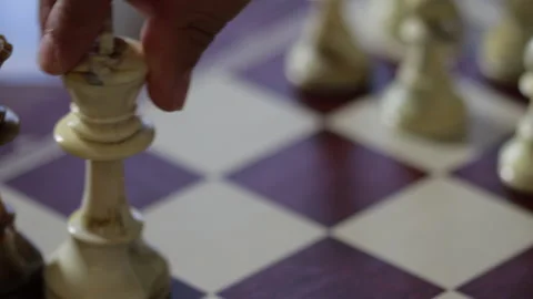 Game of chess. Man's hand moves a chess piece to victory. Strategy concept Video stock 132671194