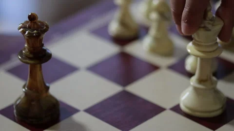 Game of chess. Man's hand moves a chess piece to victory. Strategy concept Stock Footage 132671310
