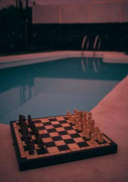 A game of chess by the pool Stock Photos