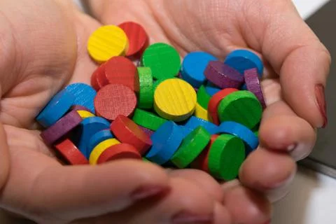 Game chips in hands Stock Photos