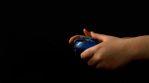 Game controller being used on black background pt 3 of 10 Stock Footage 149637063