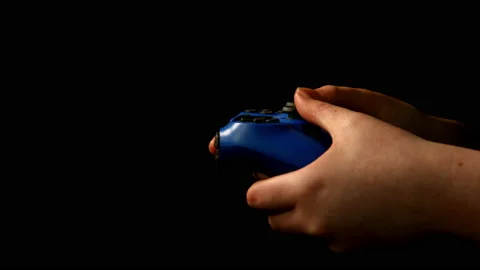 Game controller being used on black background pt 9 of 10 Stock Footage 149639186