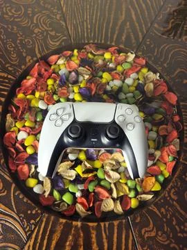 Game controller on glass top with marble in background Stock Photos