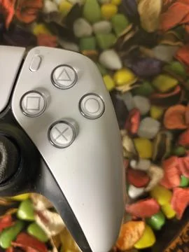 Game controller on glass top with marble in background Stock Photos