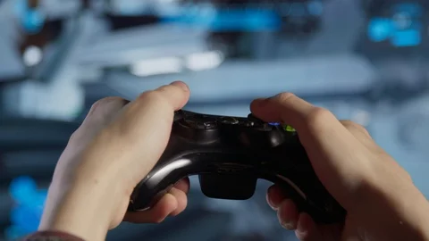 Game controller in the hand in front of screen Video stock 106378739