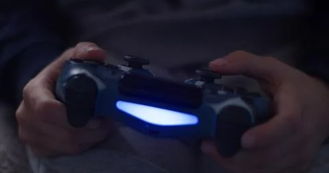 Game Controller in the Hands of a 7 Year Old Child | Kids Gaming Concept Stock Photos