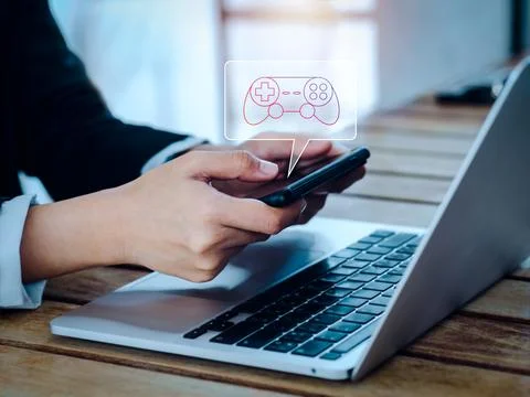 Game controller, joystick icon in bubble speech symbol appear on smart mobi.. Stock Photos
