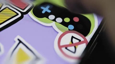 Game controller symbol contrasts with restricted phone use Stock Footage 346607663