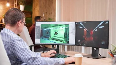 Game creator developing 3d videogame working at graphic ilustration Stock Photos