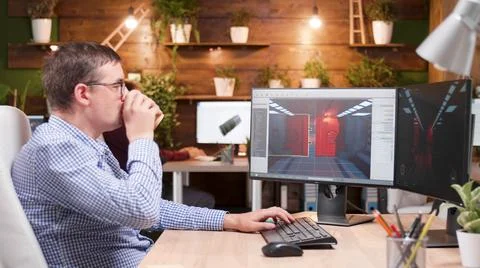 Game creator developing 3d videogame working at graphic ilustration Stock Photos