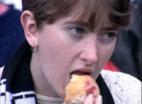 Game Day Eats: People Enjoying Food at MCG Football Match (1995) - Australia Stock Footage 228707947