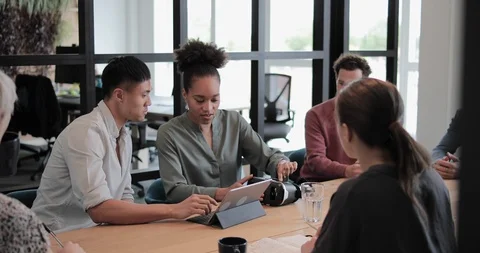 Game designers discussing VR headset technology Stock Footage 112078400
