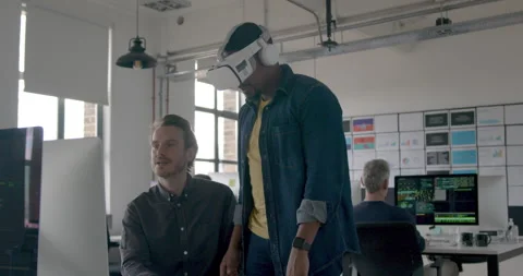 Game designers testing VR Technology in an Office Stock Footage 240230698
