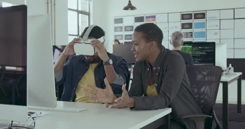 Game designers testing VR Technology in an Office Stock Footage 240232737
