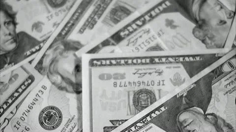 A game of dice on a pile of dollar bills Stock Footage 11338862