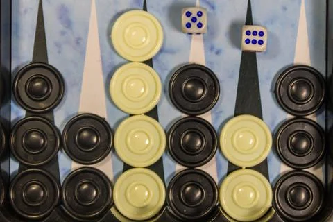 Game field in a backgammon with dice and checkers Stock Photos