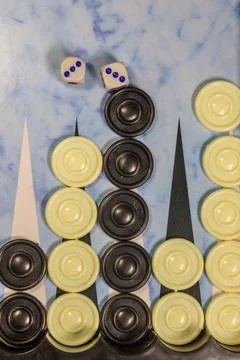 Game field in a backgammon with dice and checkers Stock Photos