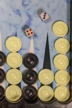 Game field in a backgammon with dice and checkers Stock Photos