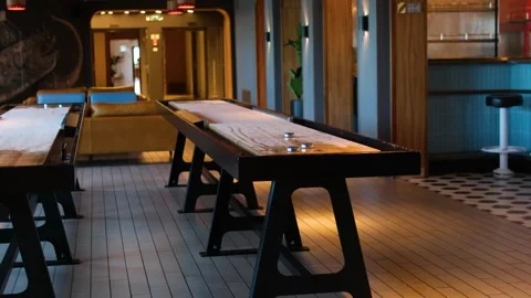Game Of Indoor Tabletop Shuffleboard Stock Footage 316074422
