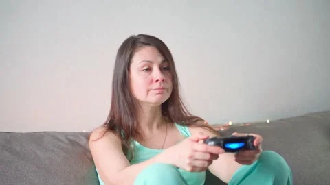Game industry. A man plays on a console after work at home. Vídeo Stock 169146892