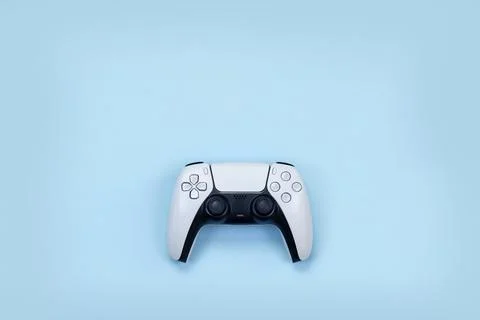 Game joystick for computer console on a blue background, layout Stock Photos