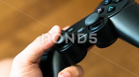 Game joystick from the console in male hands. Modern gaming technology Stock Photos