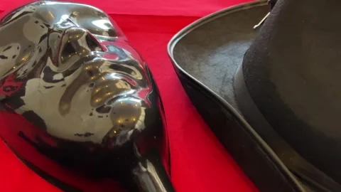 Game Mafia gun hat on a red table Stock-Footage 274299834