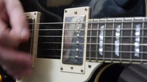 The game is a mediator on the strings of the guitar Video stock 64274824