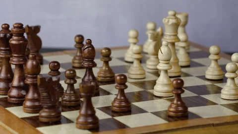 Game is on Middle of a chess match master black and white figures board Stock Footage 289230626
