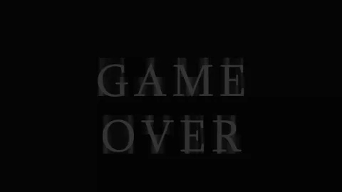 Game Over text appearing with cinematic lighting and subtle motion in dark .. Stock Footage 343413104
