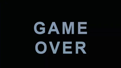 Game Over text glitching with digital interference during a retro video gam.. Stock Footage 343413129