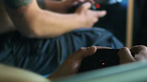Game pad black playing game hold hands close up Stock Footage 108627801